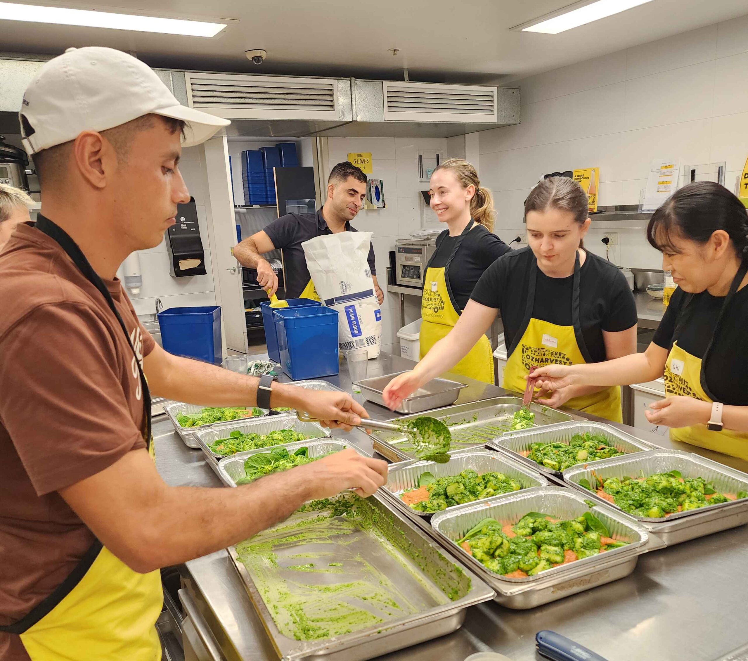 Atmos's Sydney staff volunteer to cook meals at Oz Harvest